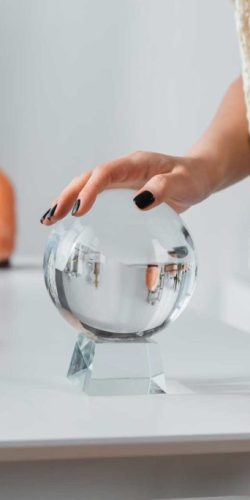 cropped-view-of-soothsayer-touching-orb-near-candl-2023-11-27-05-26-17-utc-1024x683